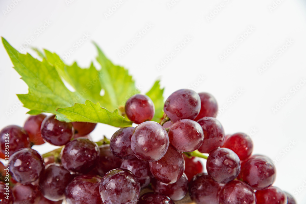 Ripe red grapes with leaves