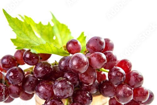 Ripe red grapes with leaves