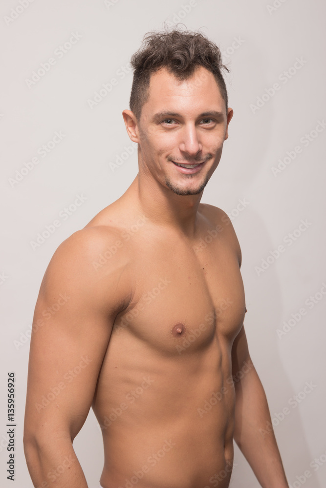 one young man model smile smirk, upper body, side view