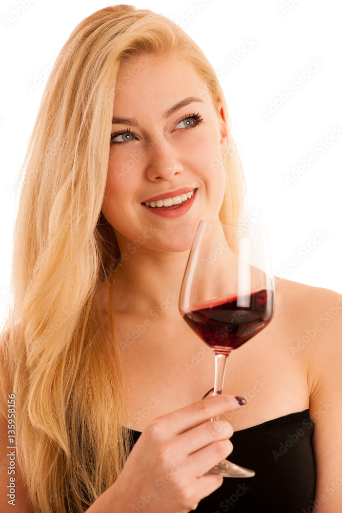 Cute blonde woman drinks a glass of red wine isolated over white Cute blonde woman drinks a glass of red wine isolated over white