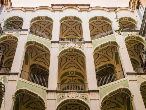 Scenographic courtyard staircases of Palazzo dello Spagnuolo, Rione Sanità, Naples, Italy
 photo