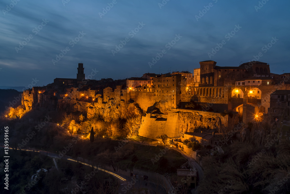 Superb view of Pitigliano, a village famous for being built on the tuff, Grosseto, Tuscany, Italy, in the evening light of the blue hour