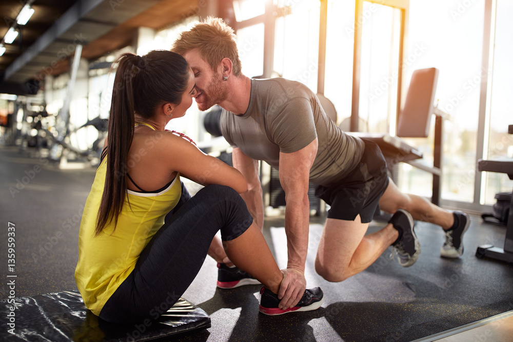 couple with close face on training in gym couple with close face on training in gym
