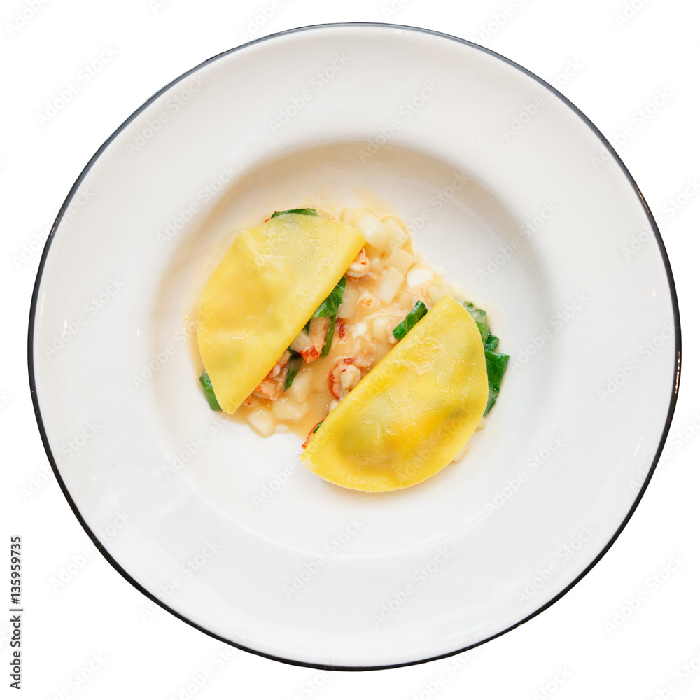Ravioli-like dish with crayfish, apples and herbs isolated on wh Ravioli-like dish with crayfish, apples and herbs isolated on wh