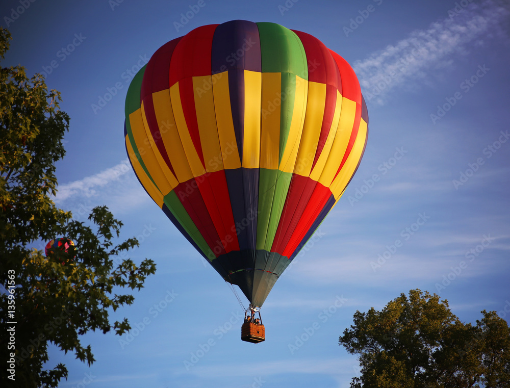 hot air balloons in the sky during sunrise on a summer day hot air balloons in the sky during sunrise on a summer day