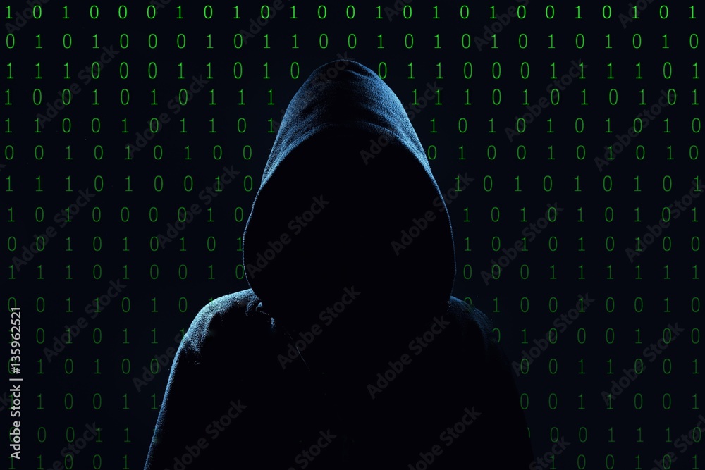 Hacker. Unrecognizable person in the hood break computer codes.
