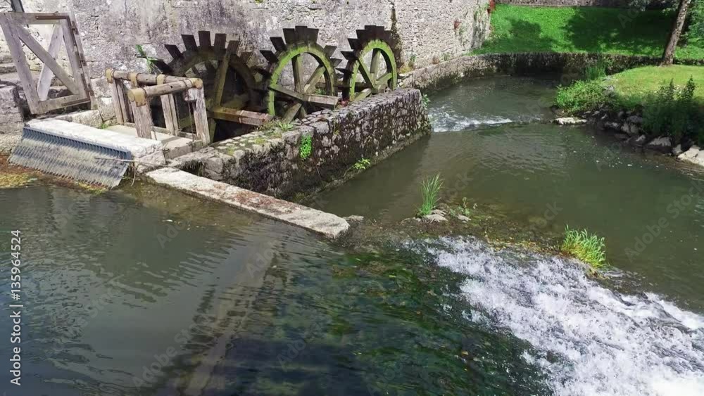 4K. Old water mill still working. Wooden wheels of old mill are rotating. Postojna Cave, Slovenia, Europe. 4K. Old water mill still working. Wooden wheels of old mill are rotating. Postojna Cave, Slovenia, Europe.