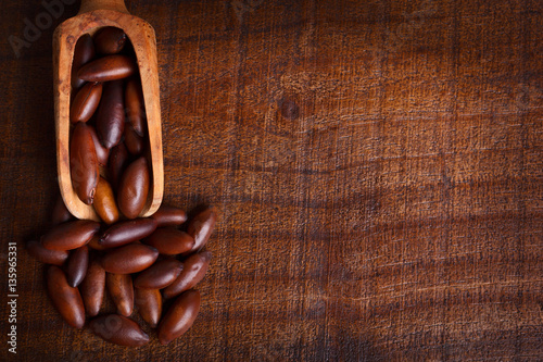 Baru almond on wooden background photo