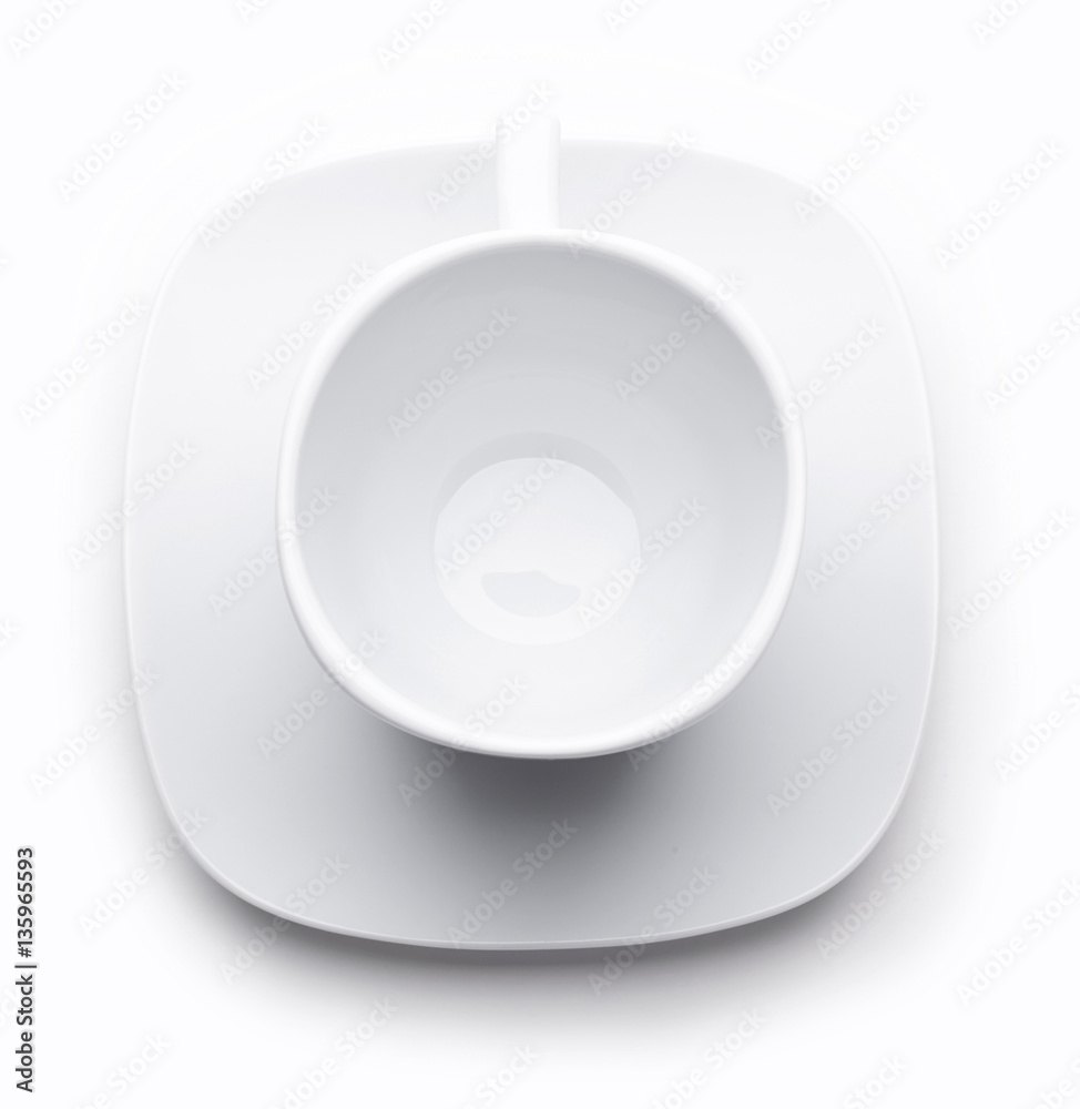 White tea or coffee cup on white saucer isolated on white. Top view White tea or coffee cup on white saucer isolated on white. Top view