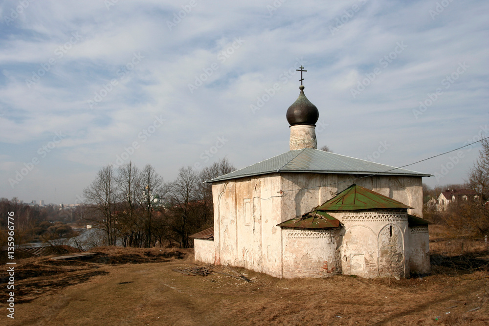 The small medieval stony church of Kouzma and Damian on the hill near Pskova-river in Pskov, Russia.