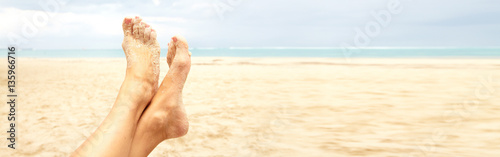 Woman legs on the beach © grinny