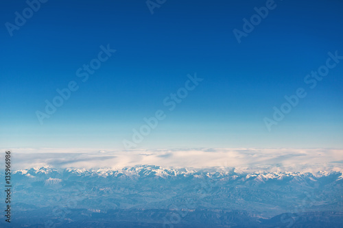 Flying above the clouds. view from the airplane, soft focus