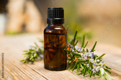 Rosemary oil in small glass bottle