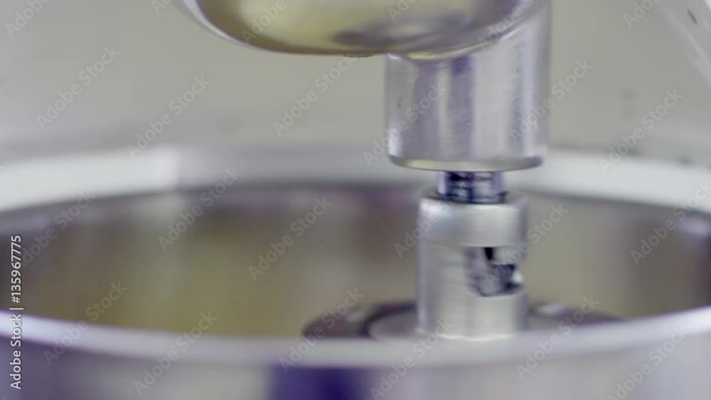 Mixer machine is whipping the cream, doing circular motions Mixer machine is whipping the cream, doing circular motions