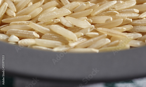 uncooked grains of brown basmati rice photo