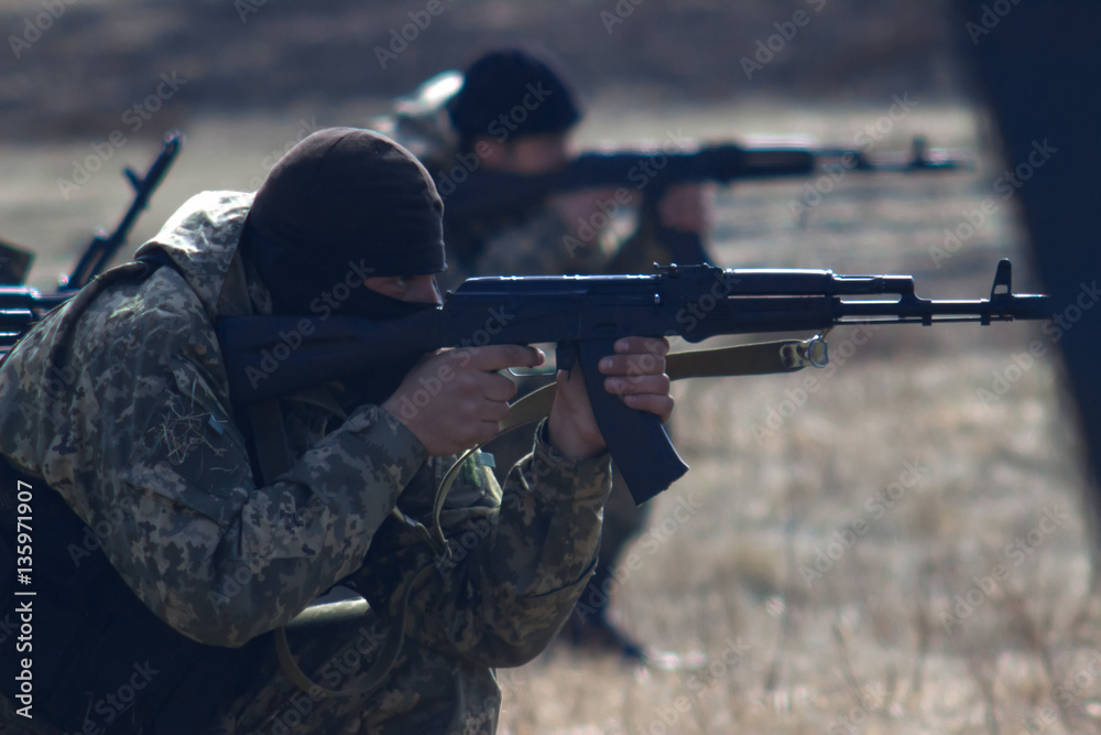 Military with kalashnikov at tactical exercises