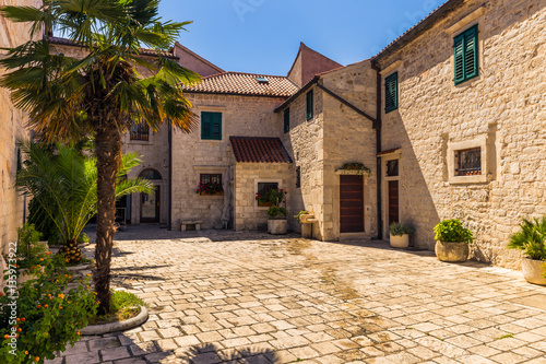 July 20, 2016: A little courtyard in the old town of Sibenik, C
