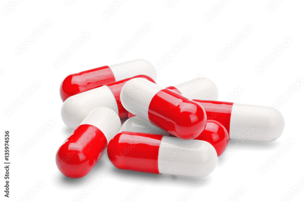 medicine red and white pills on a isolated white background medicine red and white pills on a isolated white background