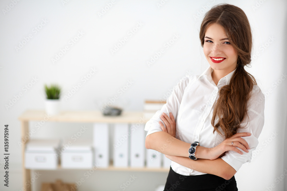 Portrait of business woman standing in office Portrait of business woman standing in office