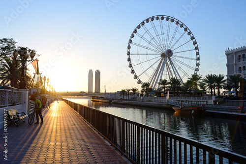 Al Qasba canal and Eye of the Emirates wheel in Sharjah photo