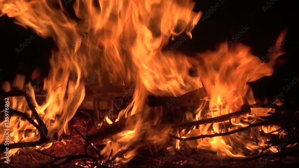 Burning Wood and Plastic during Night Burning Wood and Plastic during Night