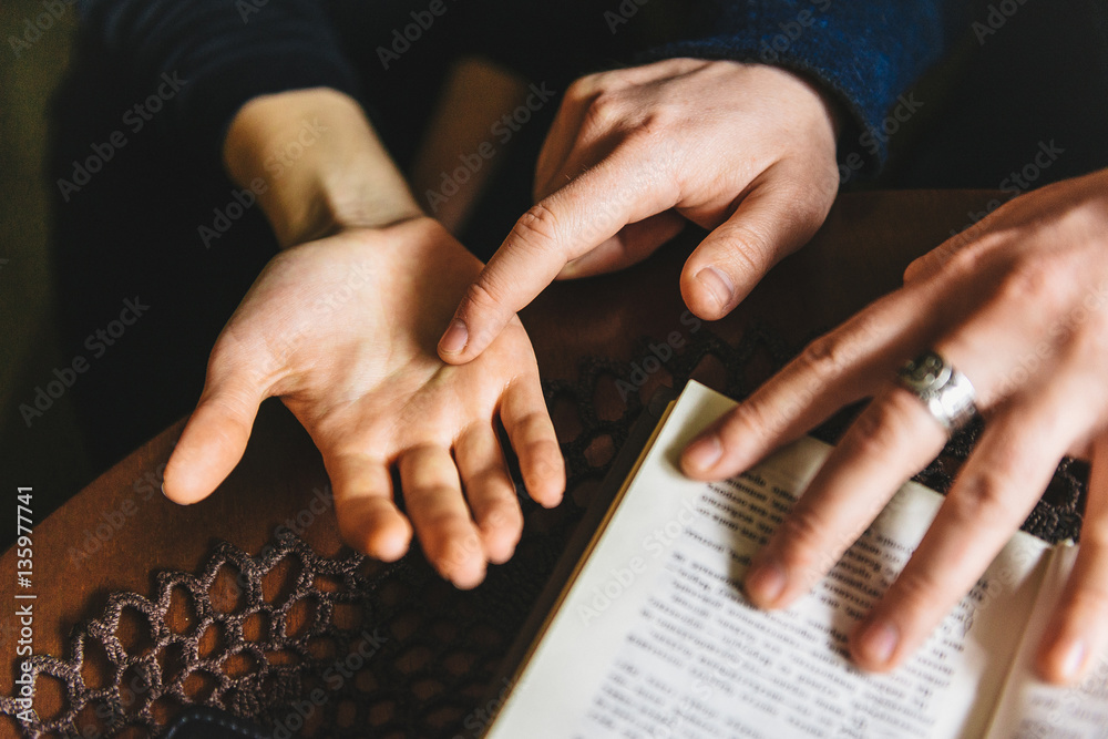 Fototapeta premium Palmistry concept. Human hand, the value of the lines on the palm.