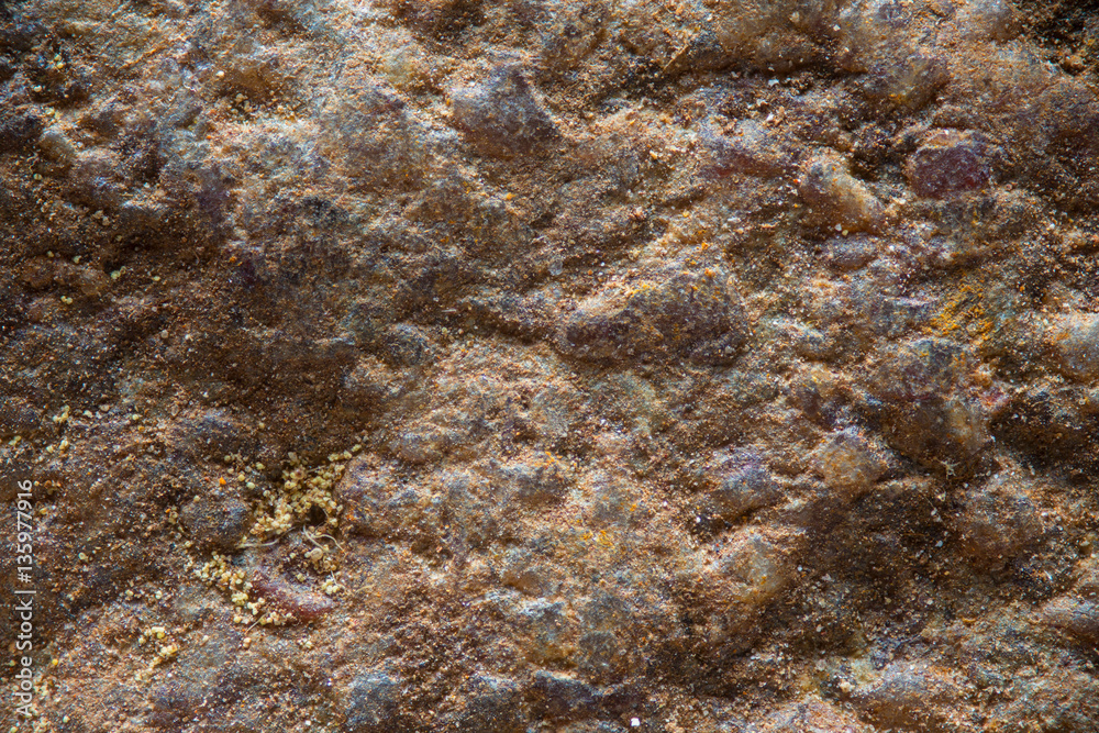 Close up texture of a dry red rock as a background