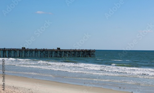 The fishing pier at the beach.