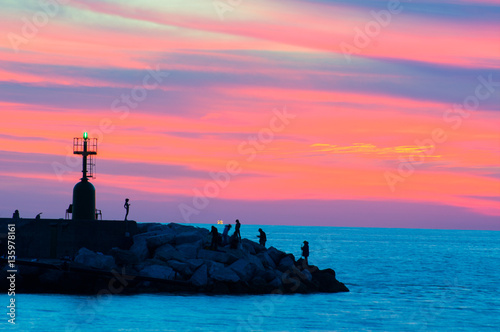 Nightview of tuscany coastline from Viareggio's port at night, in the background the Apuan Alps, Italy photo