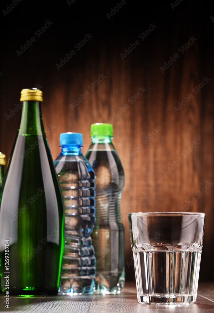 Composition with glass and bottles of mineral water Composition with glass and bottles of mineral water