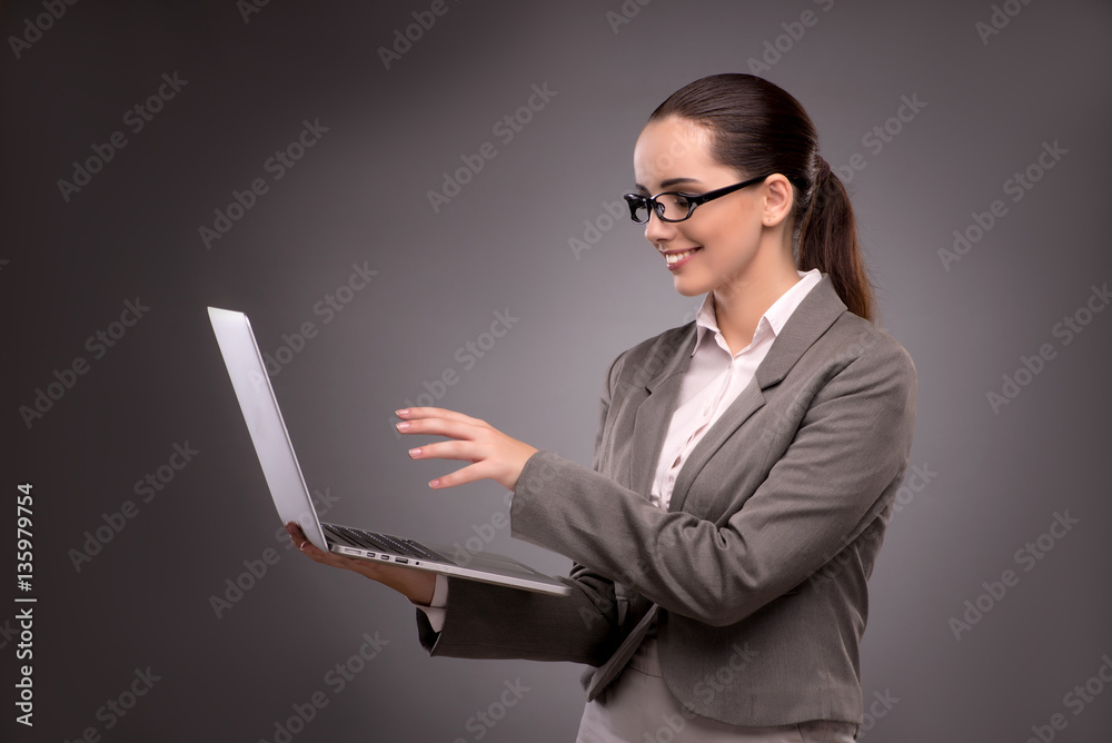 Young businesswoman working with laptop in business concept Young businesswoman working with laptop in business concept
