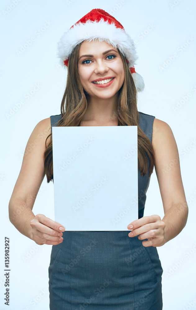 Happy business woman wearing Santa hat holding white sign board. Happy business woman wearing Santa hat holding white sign board.