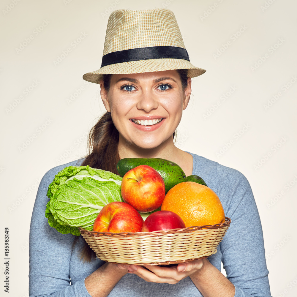Vegetarian lifestyle portrait of young woman wearing modern hat. Vegetarian lifestyle portrait of young woman wearing modern hat.