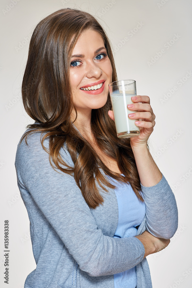 Smiling woman holding milk glass. Smiling woman holding milk glass.