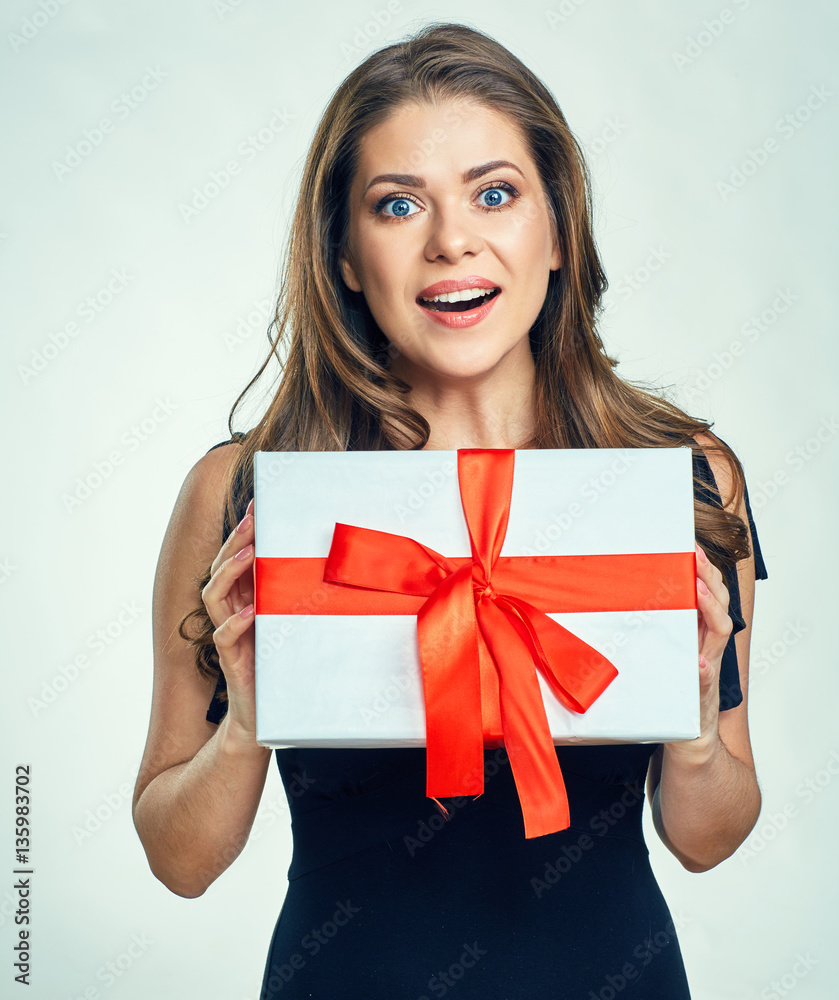 Beautiful young woman holding paper gift box.