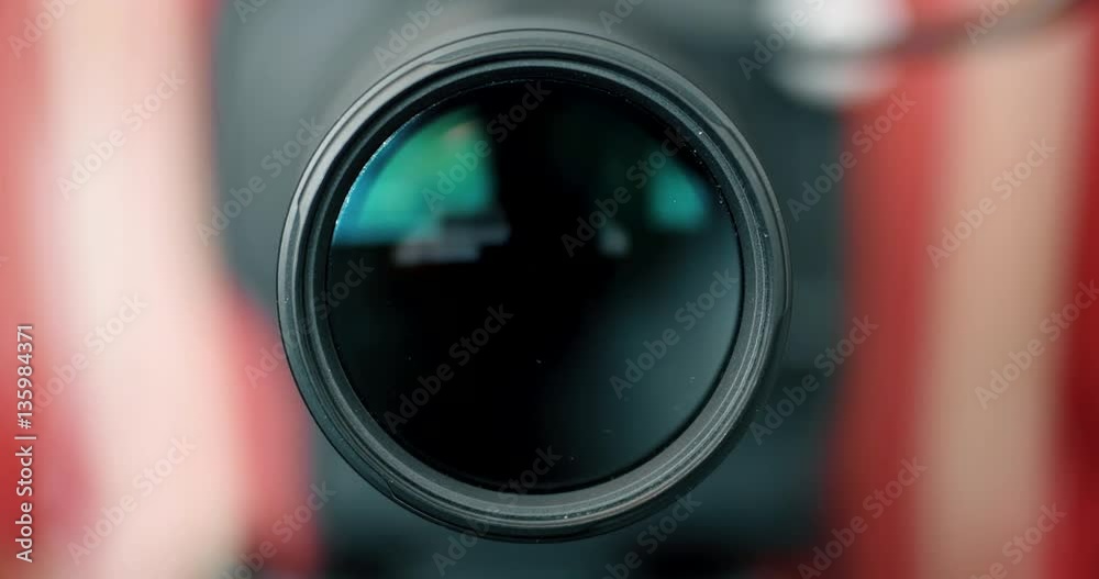 Photographer Zooming Camera Lens & Coming into Focus Photographer Zooming Camera Lens & Coming into Focus