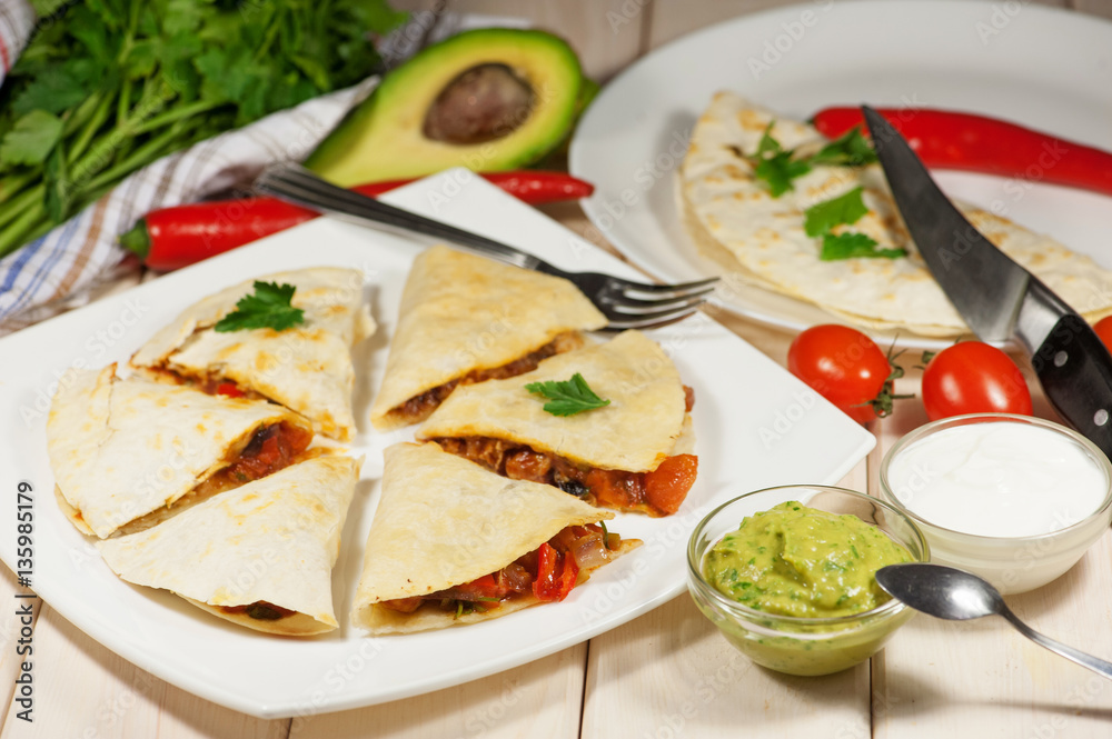 Quesadilla with chicken, served with guacamole or salsa sauce Quesadilla with chicken, served with guacamole or salsa sauce