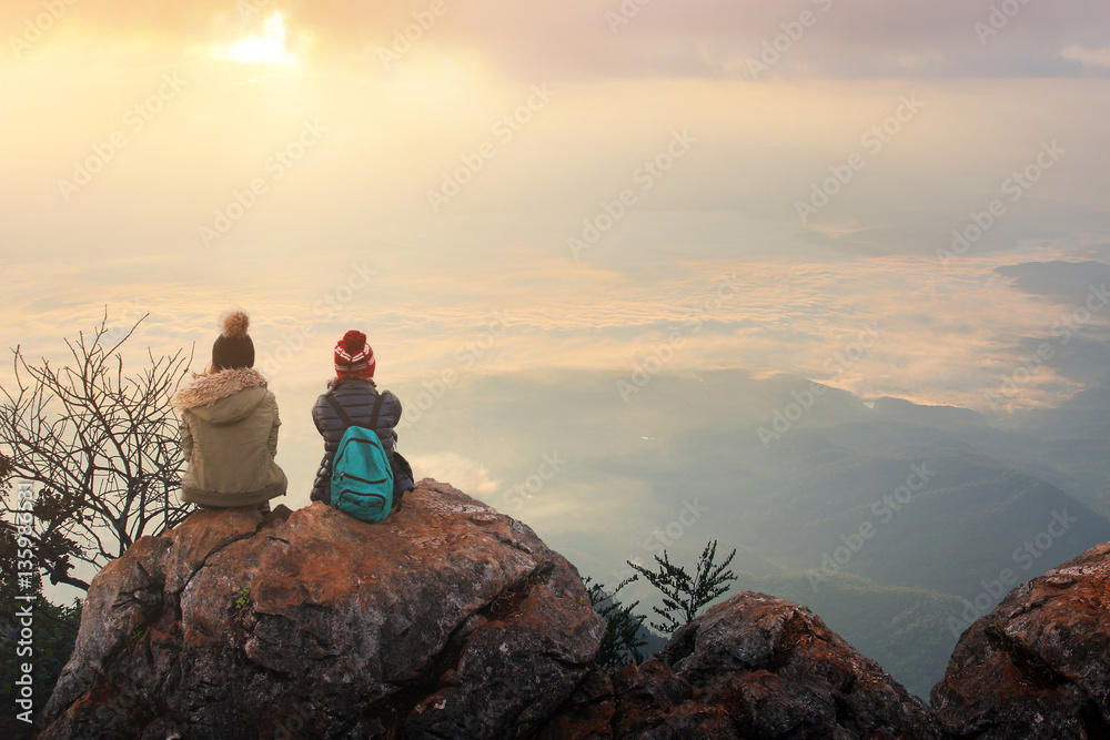 Naklejka premium Traveler sightseeing the beautiful scenery of nature and mist during time the sunrise at Doi Luang Chiang Dao,Chiang Mai province in Thailand is a very popular for photographer and tourists.