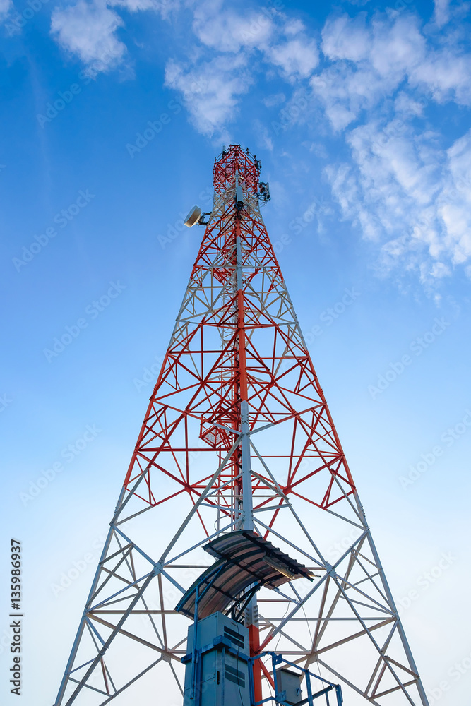 Mobile phone communication antenna tower with the blue sky and c