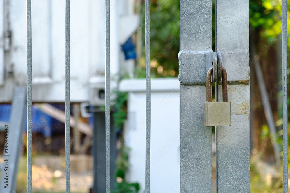 Fototapeta premium Closed metal lock door security protection padlock.