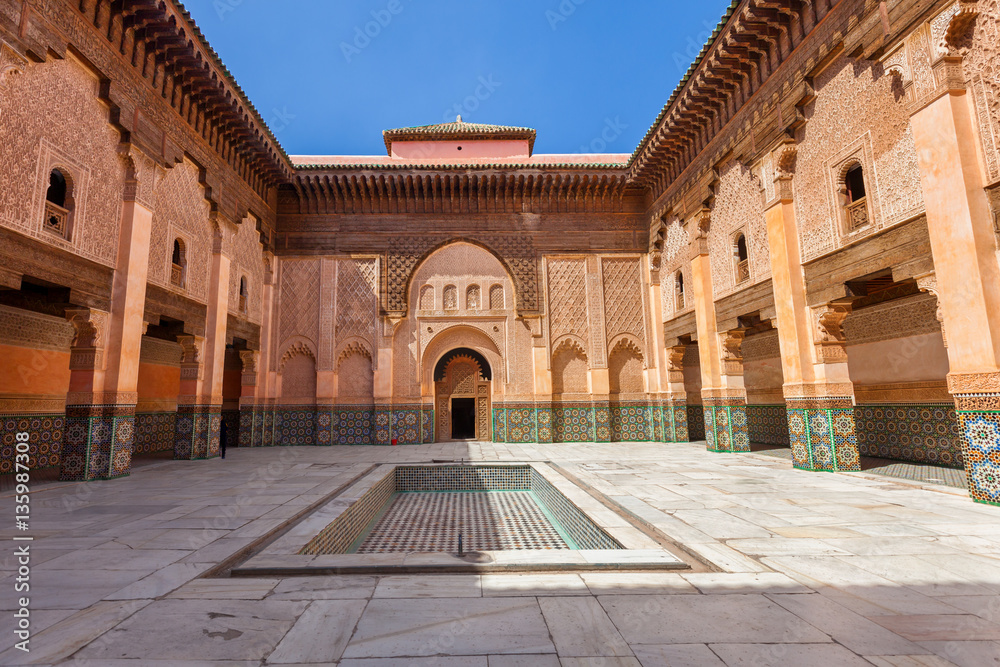 Ben Youssef Madrasa in Marrakech, Morocco. Main courtyard and ablution pool