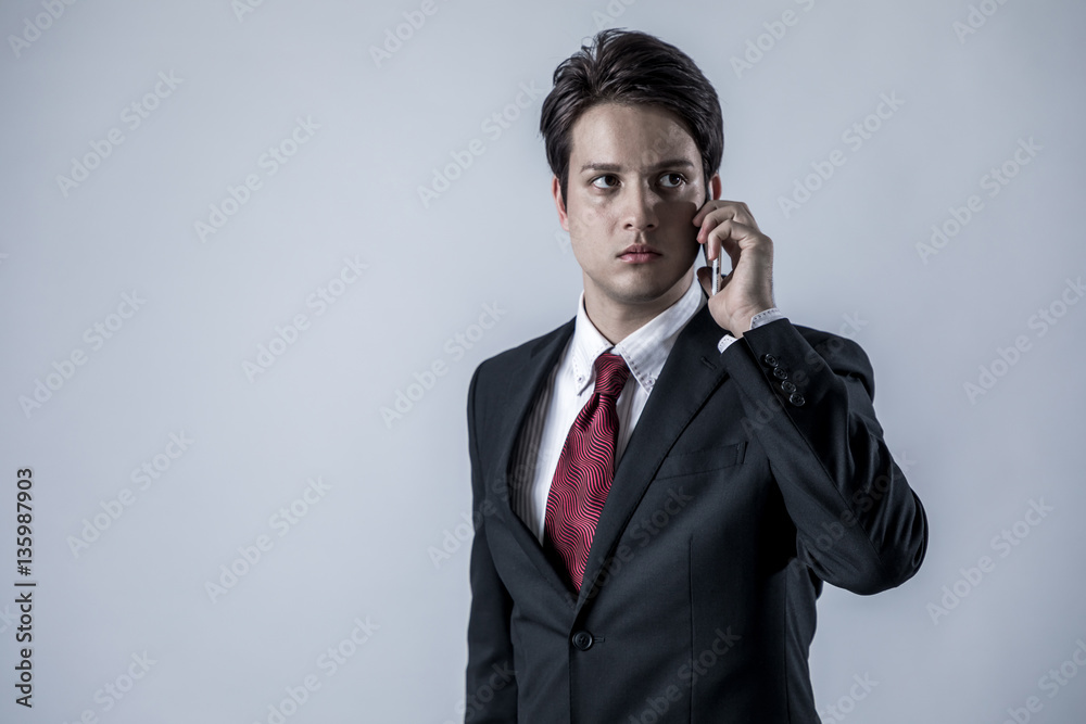 young business person making a call on the smart phone young business person making a call on the smart phone