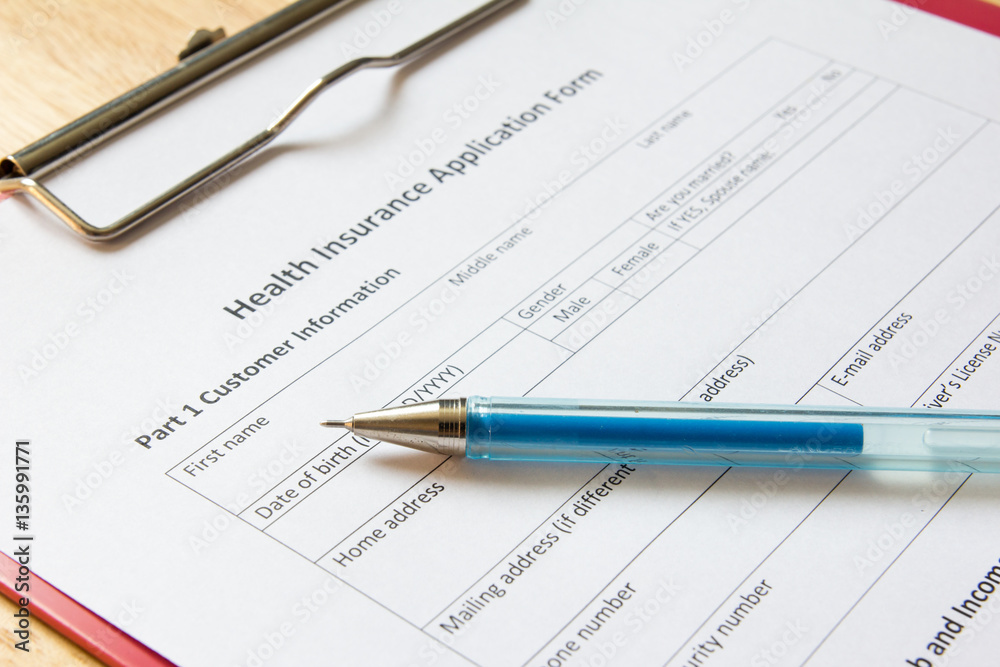 Blank health insurance application form with pen wait for fill d Blank health insurance application form with pen wait for fill d