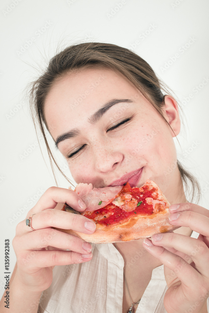 happy woman eats pizza isolated on white background