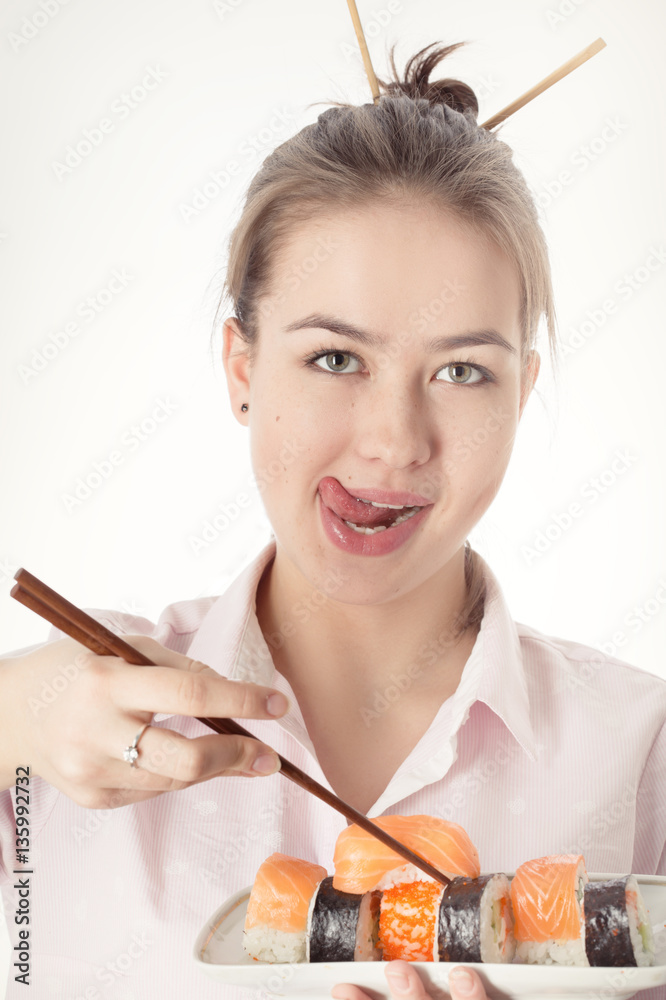 young woman with sushi smiling on white background young woman with sushi smiling on white background