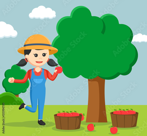 farmer woman harvesting apple tree
