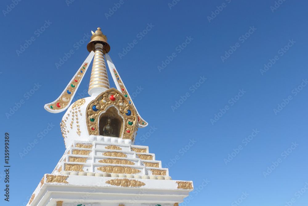 Buddhist stupa  against the background of the blue sky, a detail