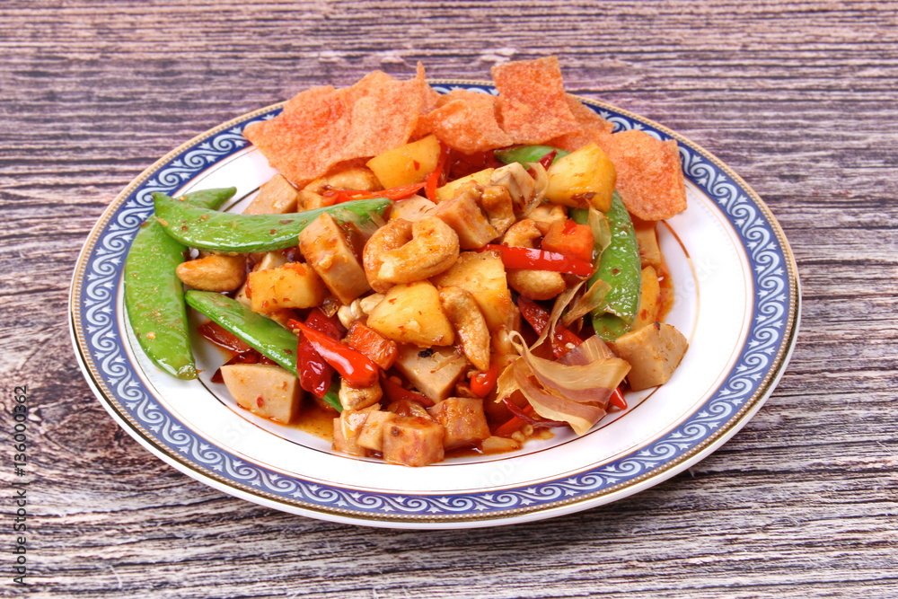 Fried mixed fruit and vegetable with roasted chili plate . Fried mixed fruit and vegetable with roasted chili plate .