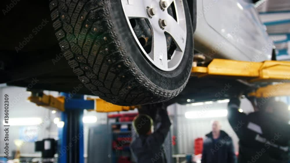 custom made wallpaper toronto digitalCar lifted in automobile service for repairing, workers fixing faults, slider