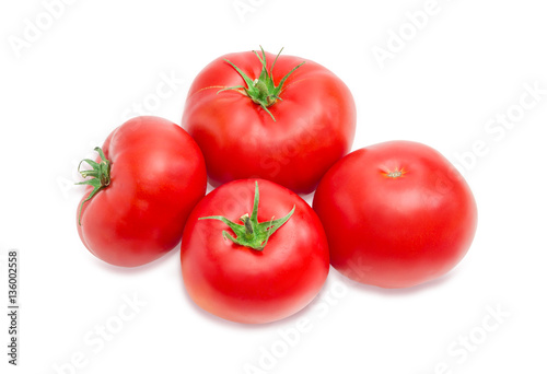 Several ripe red tomatoes closeup